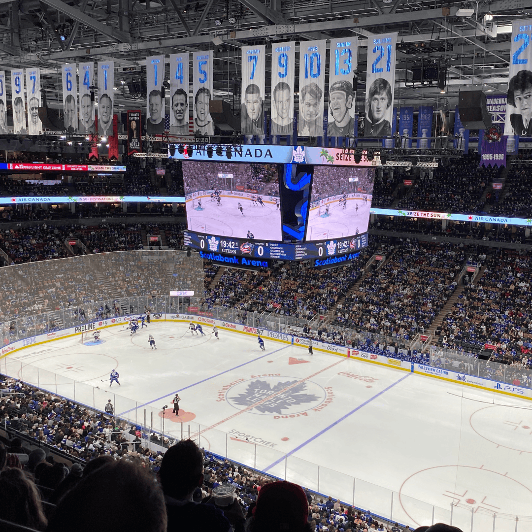 Ice hockey game at Scotiabank Arena with players and audience.